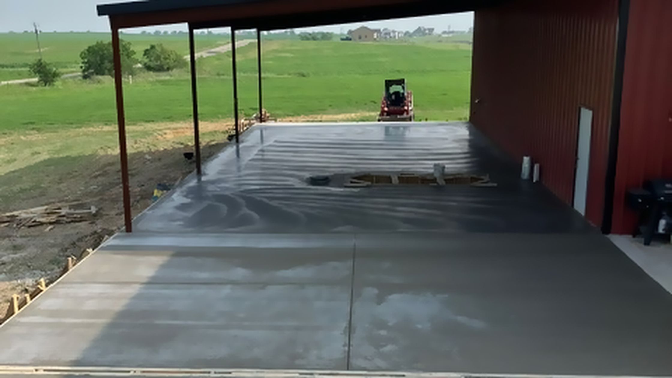 The freshly poured slab and open bay at the Torque Theory site in Coupland, Texas