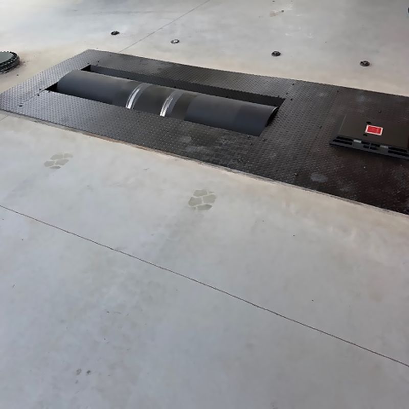 The finished bay, with the dyno rollers set flush into the floor